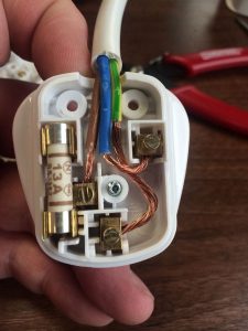 A poorly wired 13a plug on a piece of electrical equipment found during PAT testing in Coventry